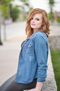 red hair senior in chambray shirt and black dress