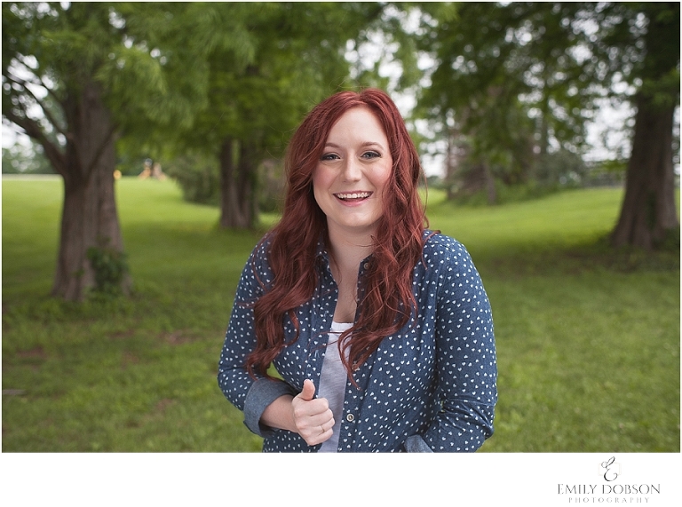 high school senior with red hair laughing