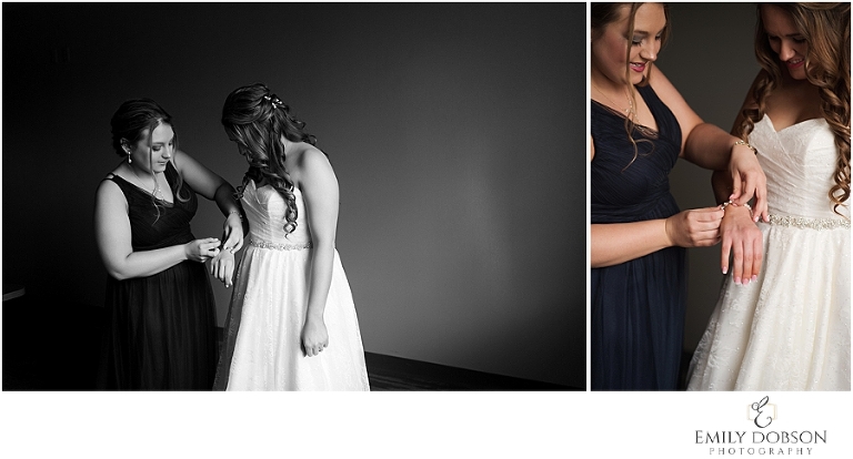 Bridesmaid helping with bracelet