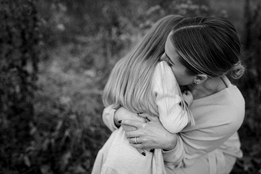 Mom embracing her daughter in a huge